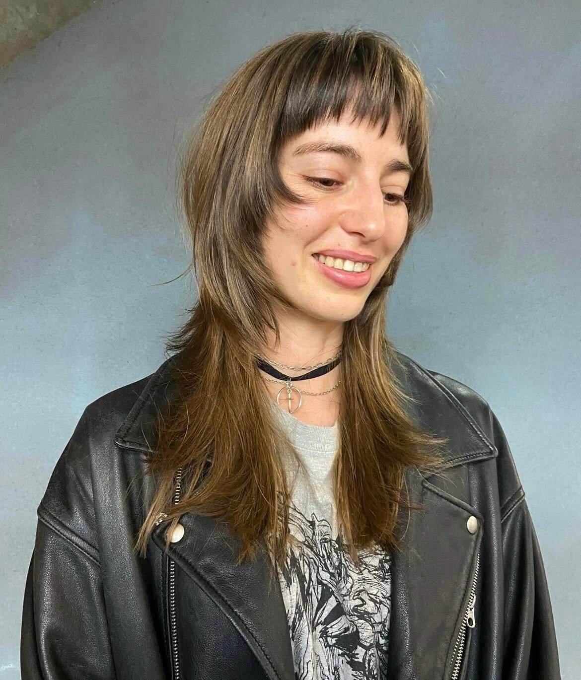 Long Butterfly Wolf cut with heavy face-framing layers and 90s-inspired blowout volume, a popular request at Assort Osaka international hair salon.