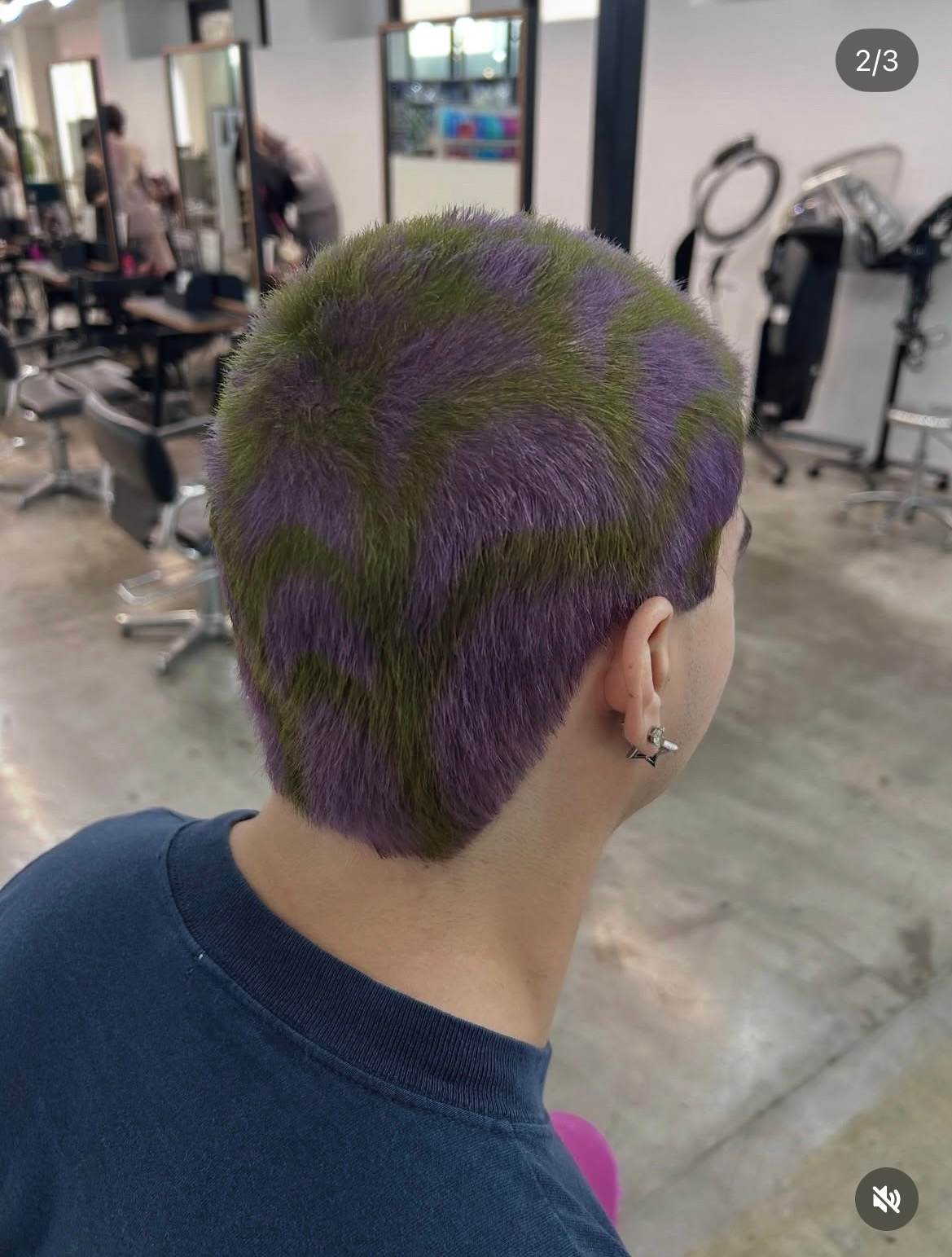Men's purple buzz cut with a detailed olive green spider web design, styled at Assort Osaka.