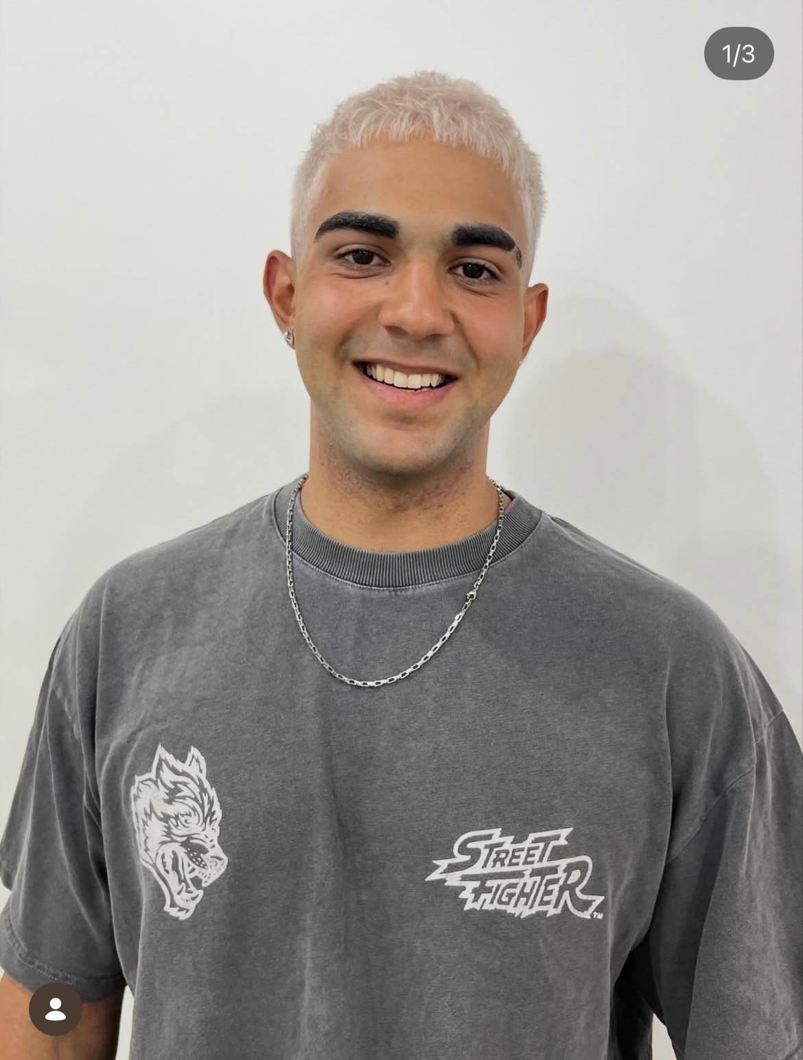 Clean, editorial solid platinum blonde buzz cut for men, a top 2026 hair trend at Assort Osaka.
